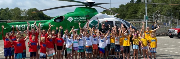Children in front of helicopter